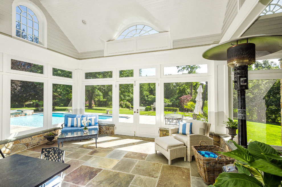 Inspiration for a mid-sized traditional sunroom in New York with terra-cotta floors and a skylight.