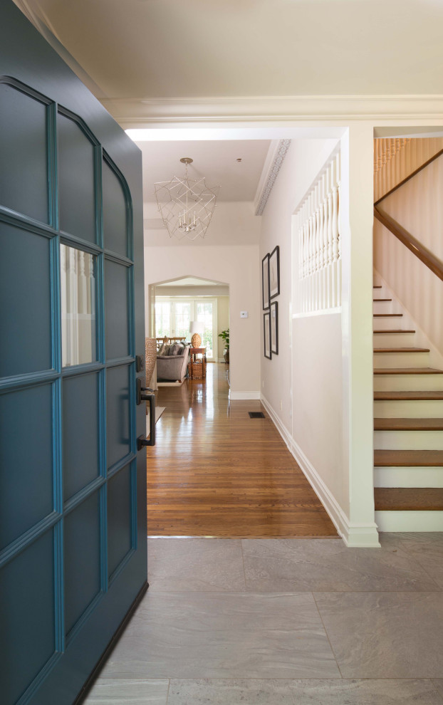 Front door - large transitional porcelain tile and gray floor front door idea in Los Angeles with white walls