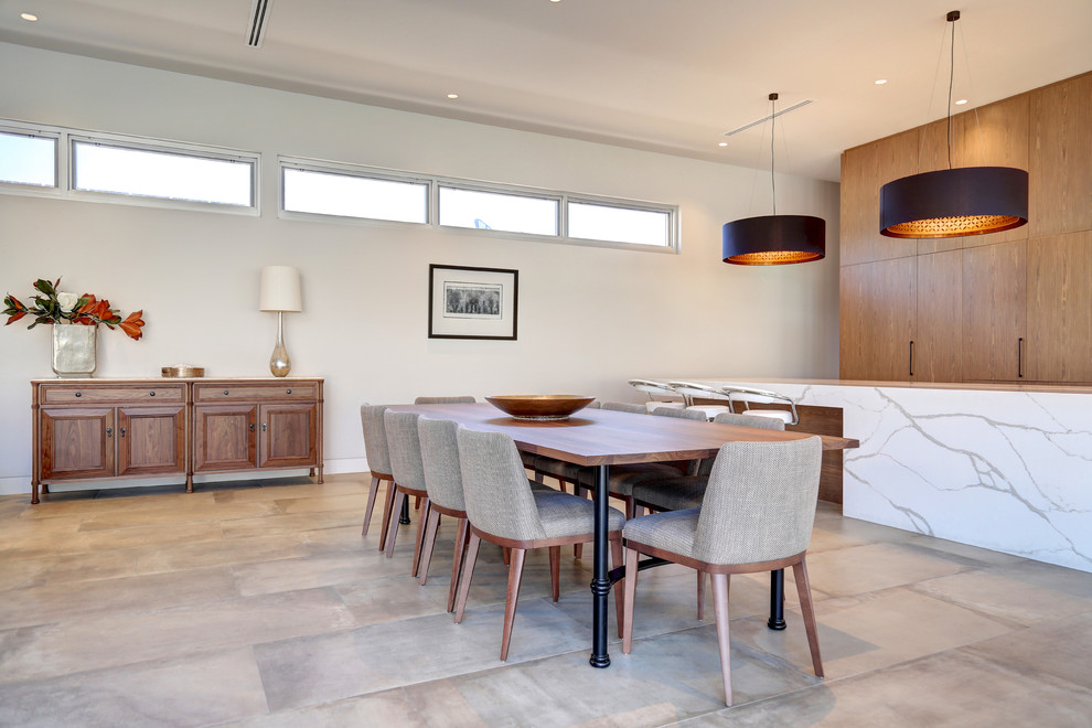 This is an example of a large contemporary open plan dining in Adelaide with grey floor, grey walls, porcelain floors and no fireplace.