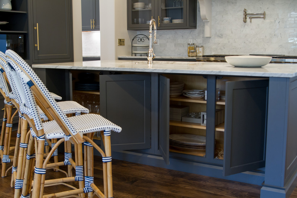 Eat-in kitchen - transitional medium tone wood floor and brown floor eat-in kitchen idea with beaded inset cabinets, gray cabinets, white backsplash, paneled appliances, an island and white countertops