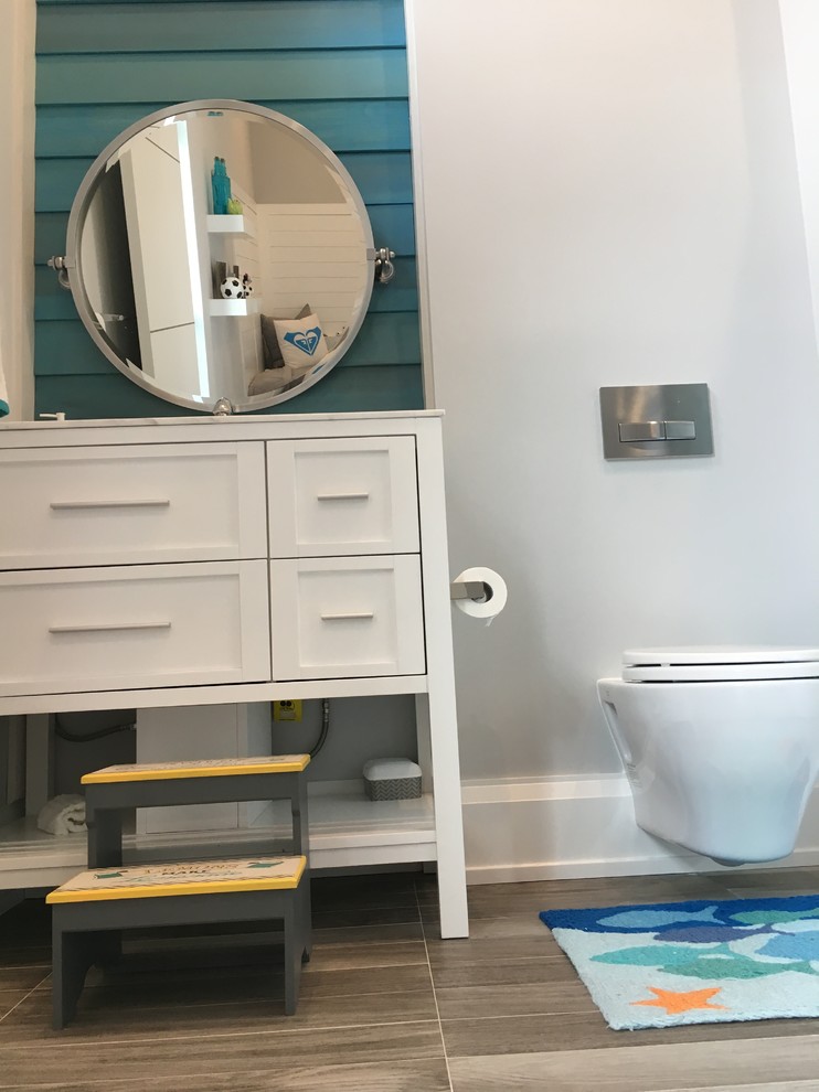 Inspiration for a transitional bathroom in Miami with shaker cabinets, white cabinets, a shower/bathtub combo, porcelain floors, quartzite benchtops and grey floor.