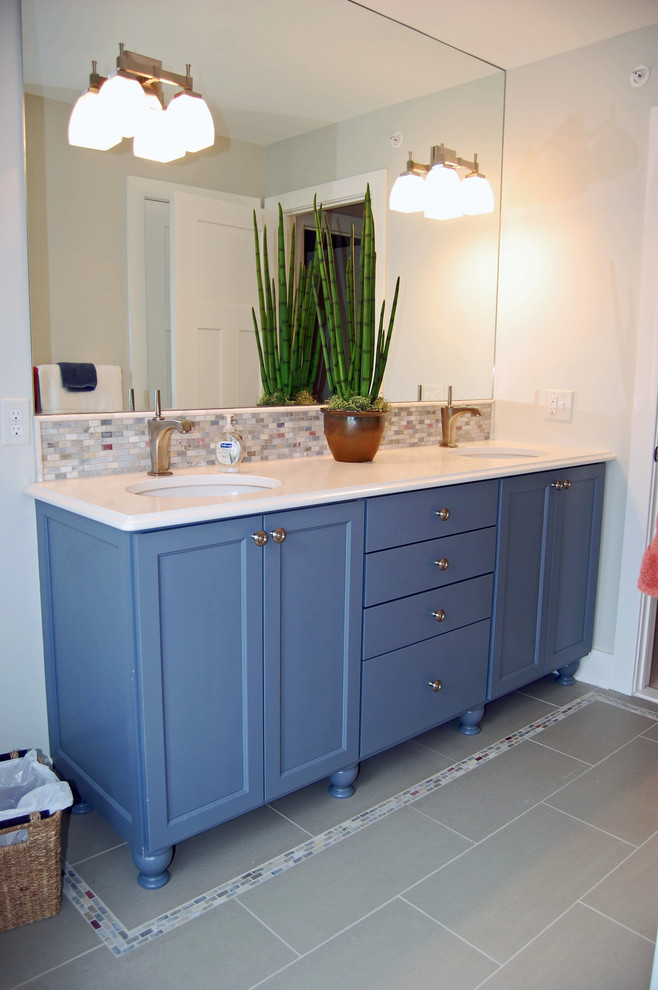 Design ideas for a mid-sized beach style master bathroom in Baltimore with an undermount sink, ceramic tile, ceramic floors, shaker cabinets, blue cabinets, a one-piece toilet, white tile and white walls.
