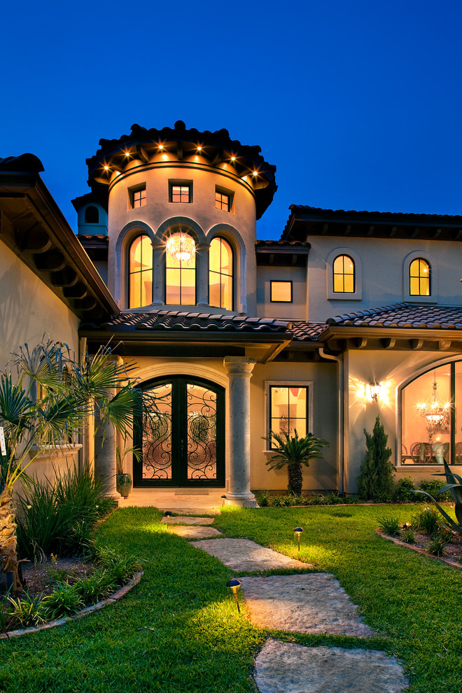 This is an example of a mediterranean two-storey exterior in Austin.