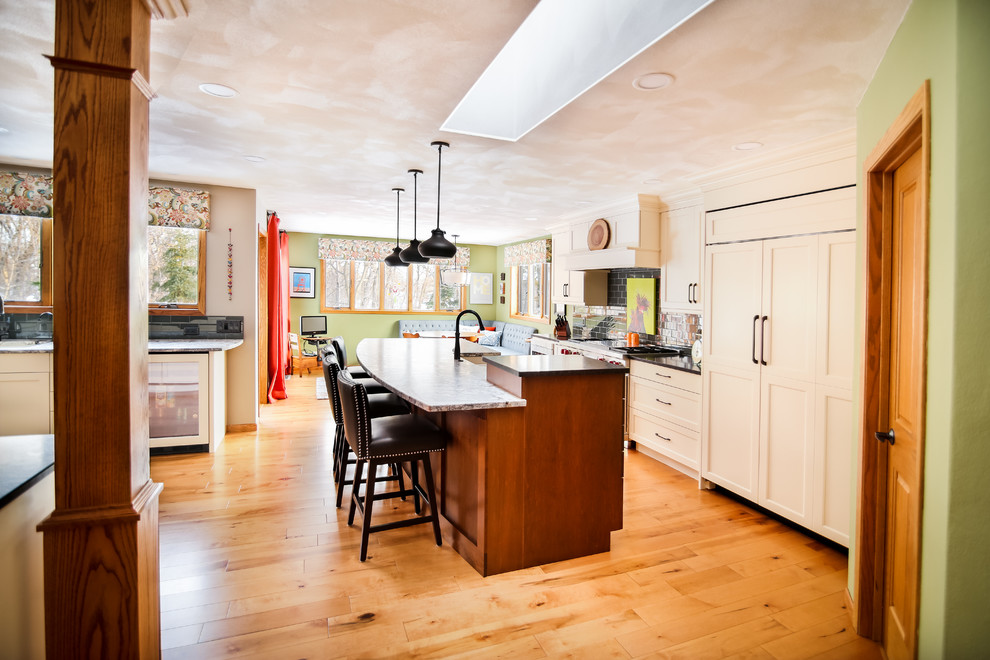 Off White Kitchen with Medium Stained Island and Granite Countertops