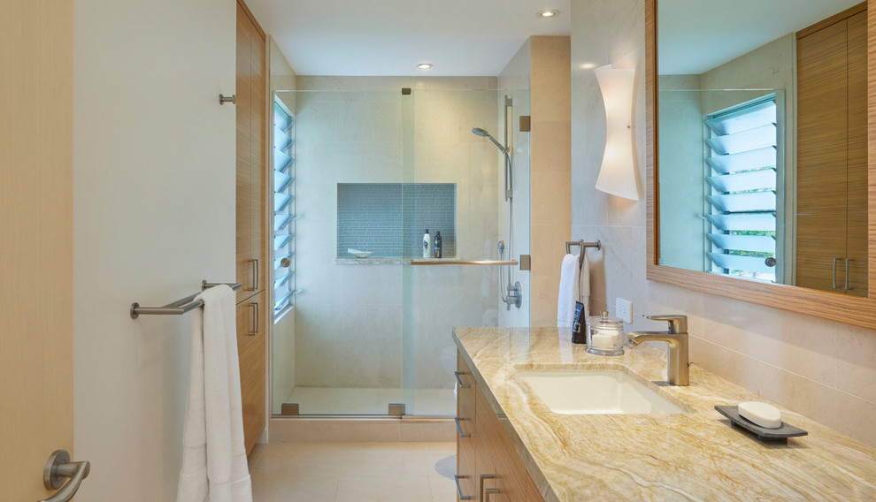 Mid-sized asian 3/4 bathroom in Hawaii with flat-panel cabinets, brown cabinets, an alcove shower, beige tile, beige walls, beige floor, a sliding shower screen, quartzite benchtops and brown benchtops.