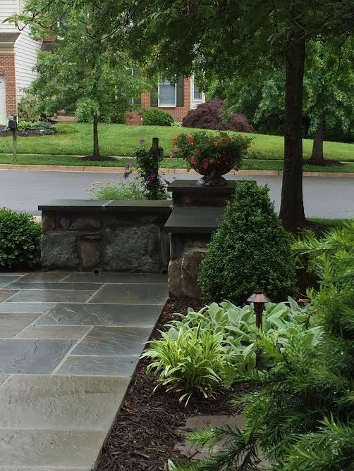 Inspiration for a small traditional front yard partial sun garden in DC Metro with natural stone pavers.