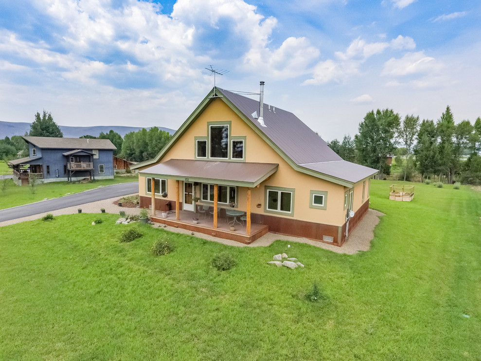 Example of a mountain style home design design in Denver