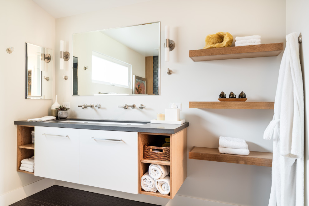 Photo of a mid-sized contemporary bathroom in Orange County with flat-panel cabinets, white cabinets, white walls, mosaic tile floors, an undermount sink, black floor, grey benchtops and a floating vanity.