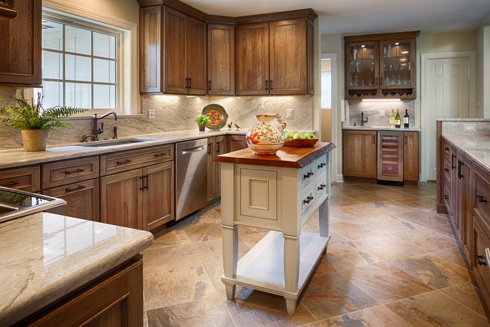 Kitchen - u-shaped porcelain tile kitchen idea in DC Metro with quartzite countertops and an island