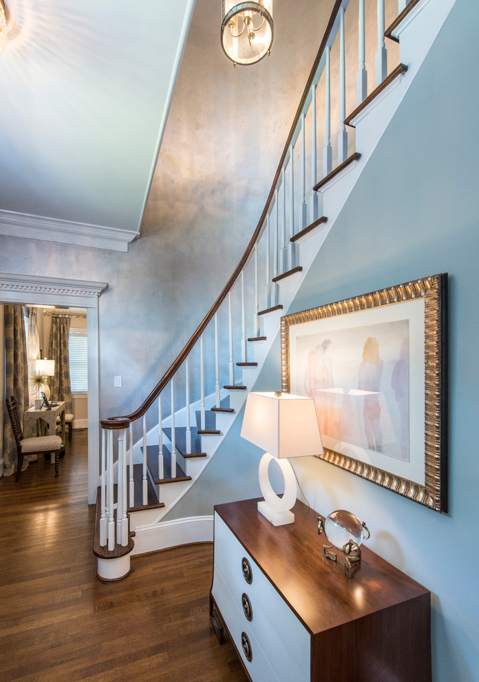 Large transitional foyer in Raleigh with blue walls and medium hardwood floors.