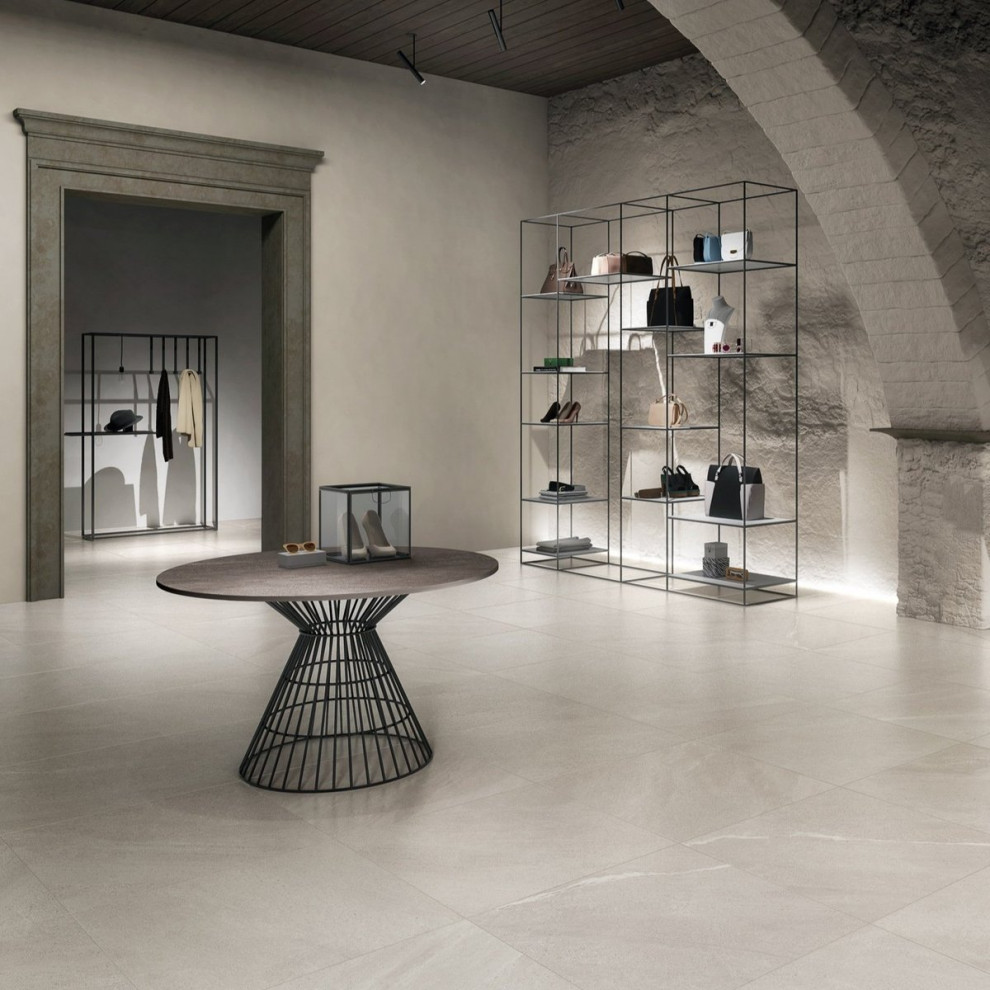 Design ideas for a contemporary wardrobe in London with porcelain flooring and grey floors.