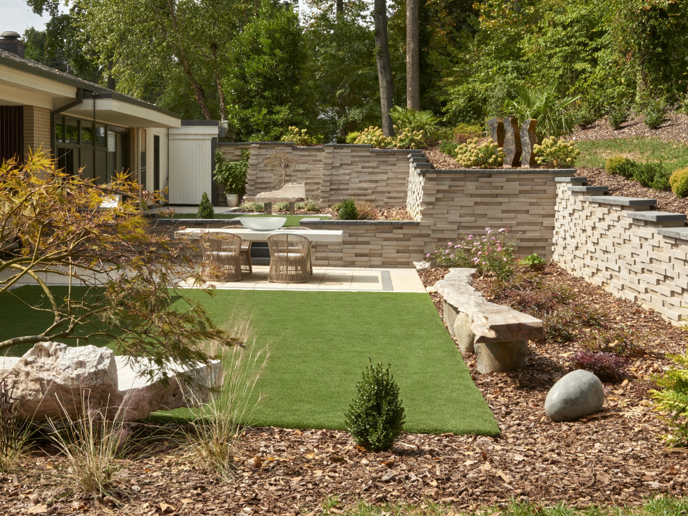 Contemporary backyard garden in Philadelphia with a garden path and concrete pavers.