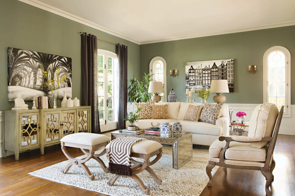 Inspiration for a large traditional formal enclosed living room in Los Angeles with green walls, medium hardwood floors, no fireplace and no tv.