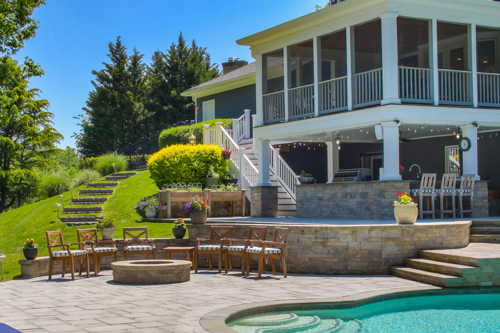 Inspiration for a mid-sized transitional backyard stone and custom-shaped lap pool remodel in DC Metro