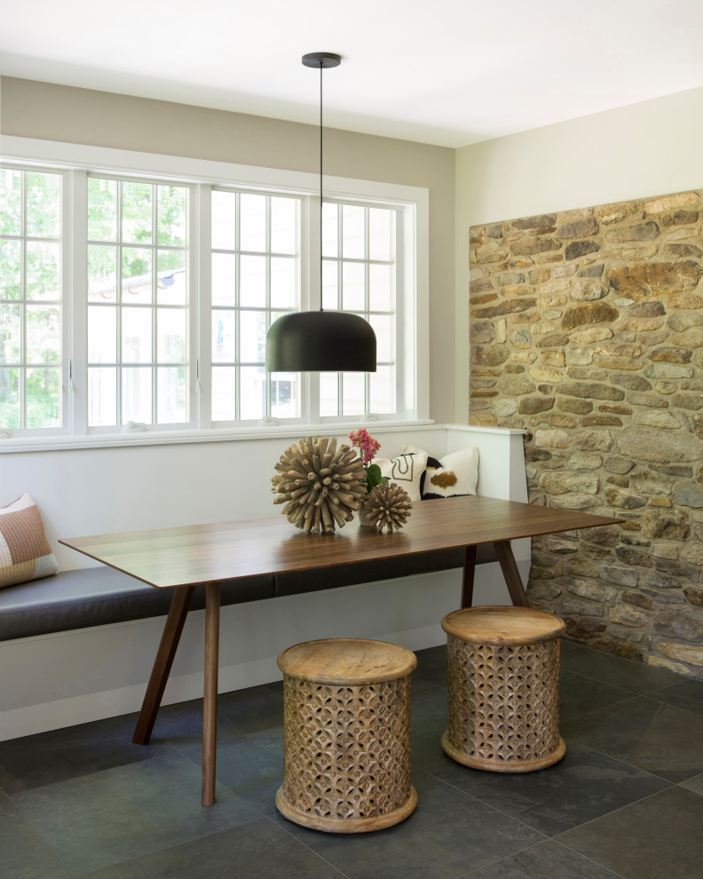Inspiration for a mid-sized farmhouse porcelain tile and gray floor kitchen/dining room combo remodel in New York