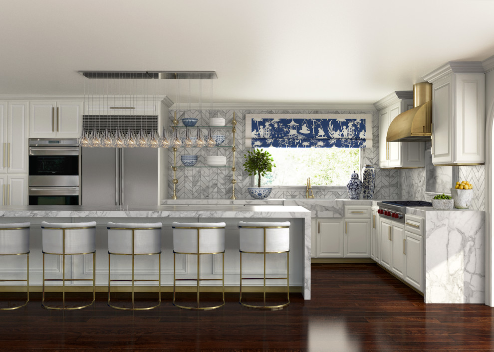 Design ideas for a large transitional l-shaped kitchen in Orange County with a farmhouse sink, raised-panel cabinets, white cabinets, marble benchtops, grey splashback, stone tile splashback, stainless steel appliances, dark hardwood floors and with island.