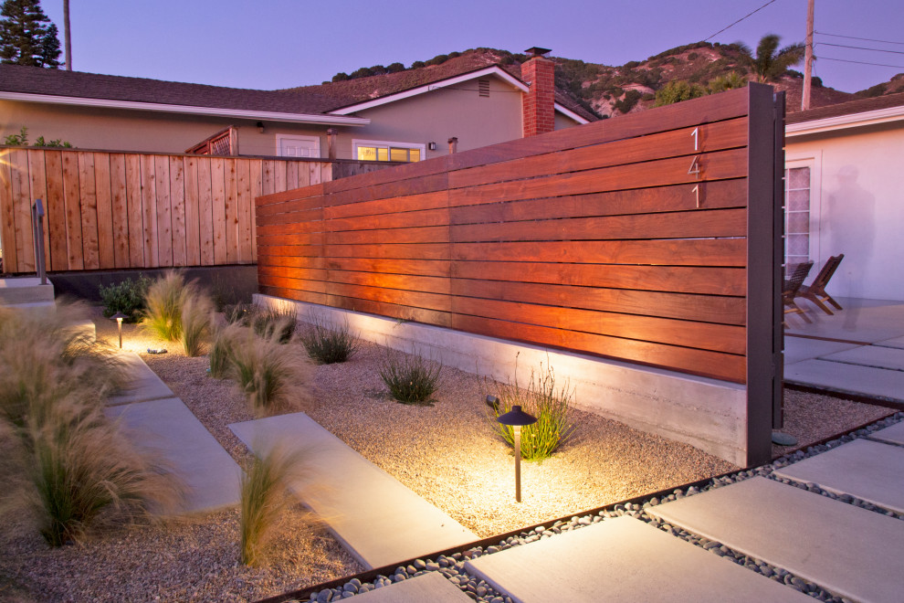 This is an example of a mid-sized modern front yard patio in San Luis Obispo with concrete slab.