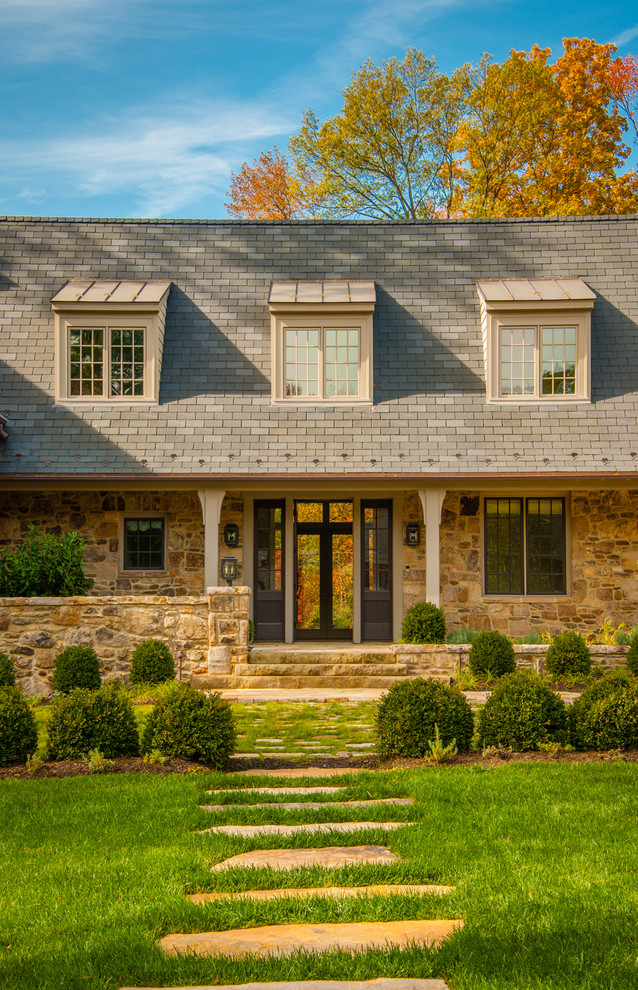 This is an example of a traditional two-storey brown exterior in DC Metro with stone veneer.