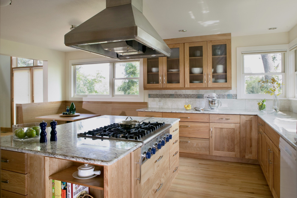 Photo of a contemporary kitchen in Denver with glass-front cabinets.