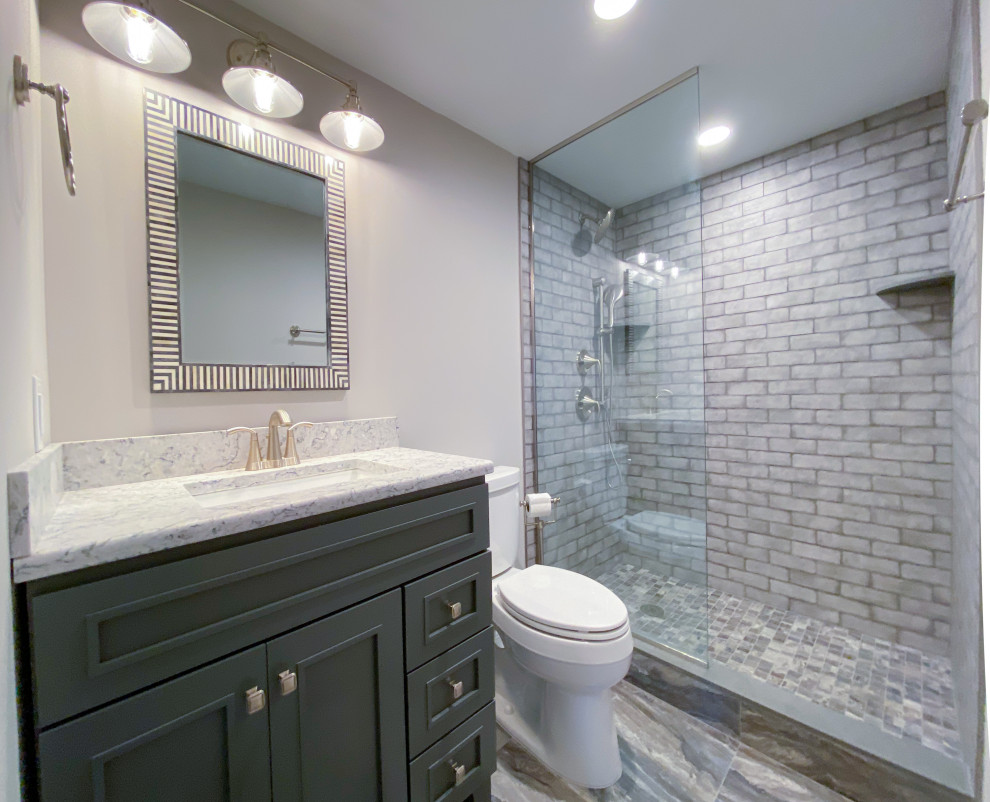 Photo of a small beach style 3/4 bathroom in Philadelphia with grey cabinets, an open shower, gray tile, subway tile, grey walls, ceramic floors, quartzite benchtops, grey floor, an open shower, white benchtops, a single vanity and a freestanding vanity.