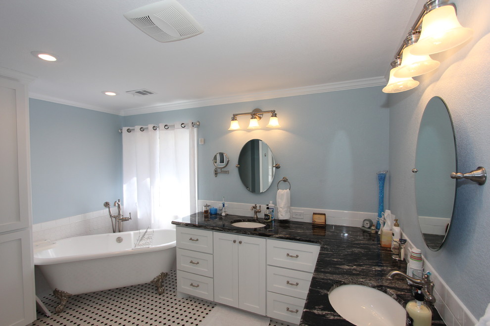 Design ideas for a mid-sized traditional master bathroom in Other with recessed-panel cabinets, white cabinets, a claw-foot tub, an alcove shower, ceramic tile, blue walls, ceramic floors, an undermount sink, marble benchtops, white tile, white floor and a hinged shower door.