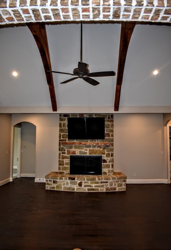 This is an example of a country family room in Houston.
