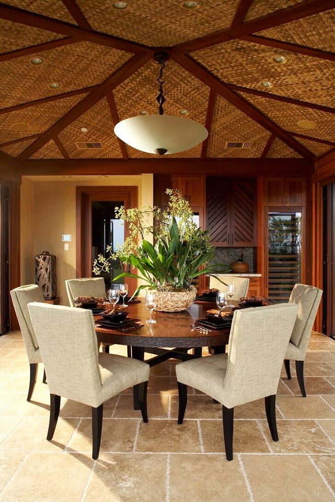 Photo of a tropical dining room in Hawaii with beige floor.