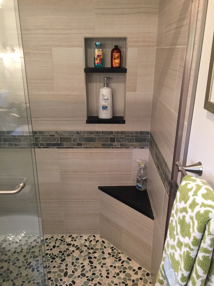 Small beach style 3/4 bathroom in Orange County with beaded inset cabinets, white cabinets, an alcove shower, a one-piece toilet, beige tile, porcelain tile, white walls, porcelain floors, an undermount sink, soapstone benchtops, grey floor and a sliding shower screen.