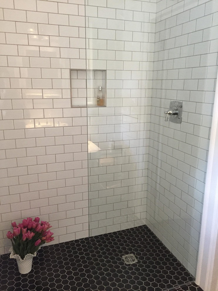 This is an example of a small contemporary 3/4 wet room bathroom in Other with open cabinets, white tile, subway tile, white walls, porcelain floors, a pedestal sink and glass benchtops.