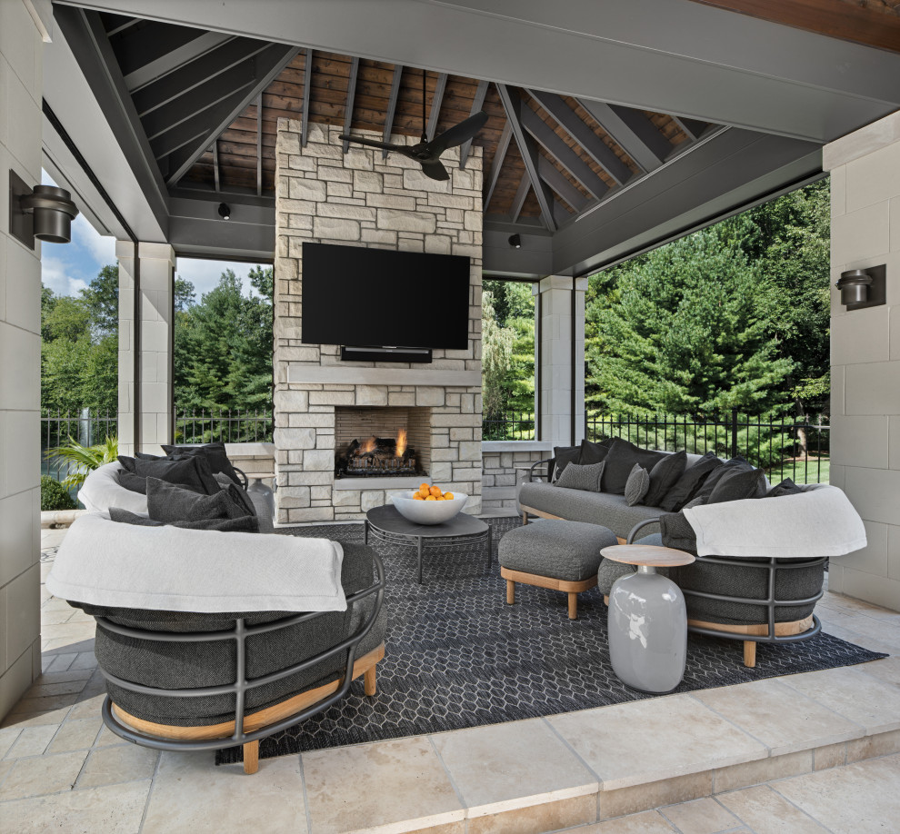 Inspiration for a transitional patio in Detroit with with fireplace and a gazebo/cabana.