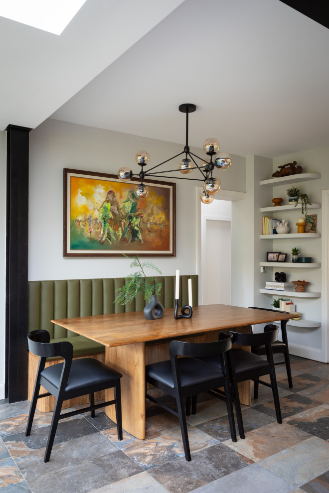 Contemporary dining room in London with white walls and multi-coloured floors.