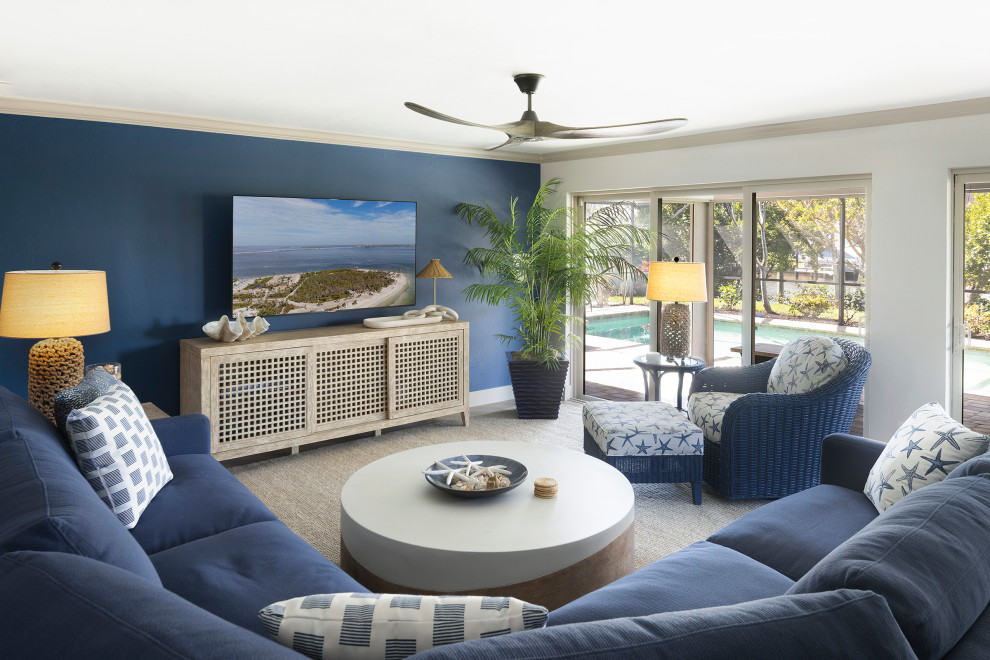 Beach style open concept family room photo in Orlando with blue walls