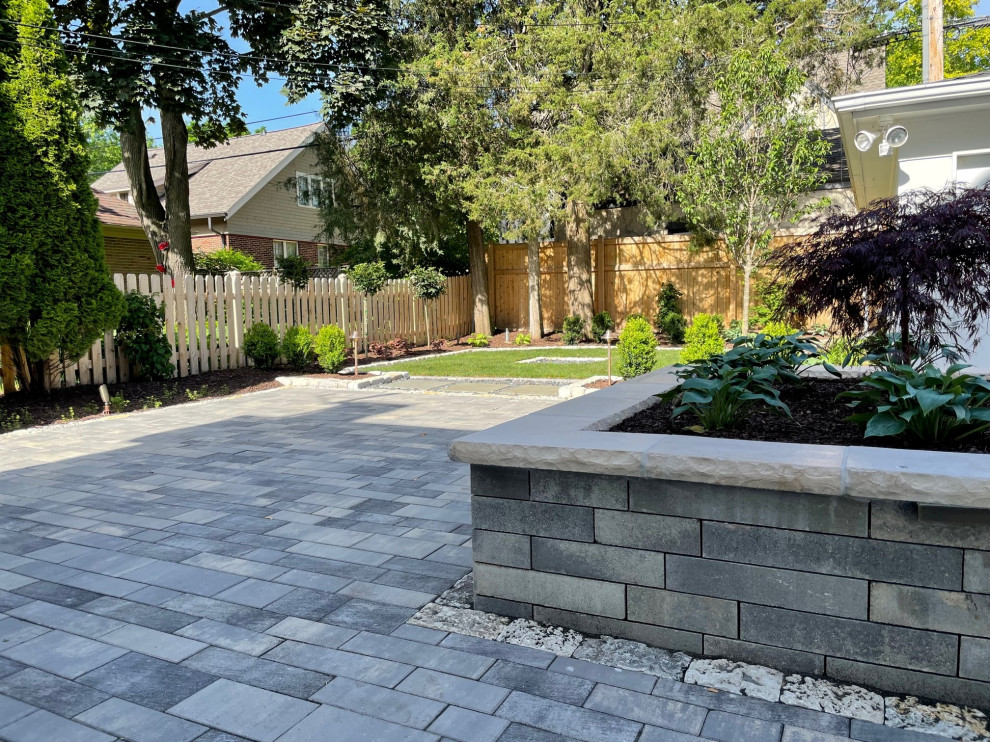 Inspiration for a small modern full sun backyard concrete paver raised garden bed in Milwaukee for summer.