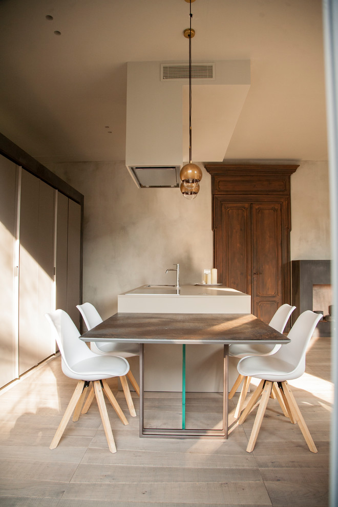 Photo of a contemporary dining room in Milan with beige walls.