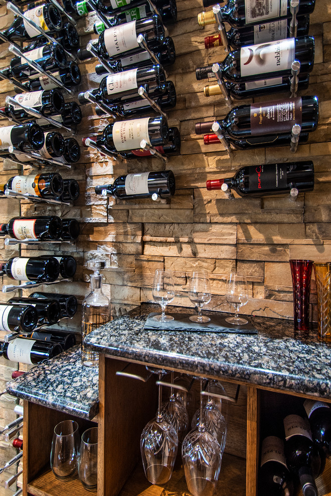 Design ideas for a small traditional wine cellar in Dallas with medium hardwood floors and display racks.