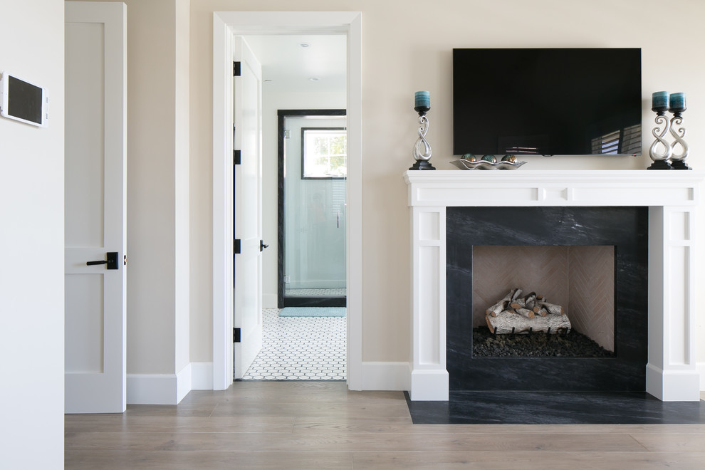 Example of a transitional bedroom design in Orange County