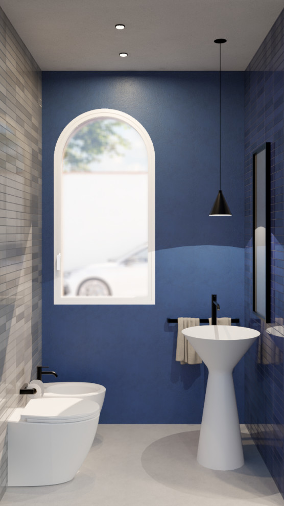 Photo of a small contemporary bathroom in Catania-Palermo with black cabinets, a two-piece toilet, blue tiles, matchstick tiles, multi-coloured walls, concrete flooring, a pedestal sink, solid surface worktops, grey floors, grey worktops, a wall niche, a single sink, a freestanding vanity unit, a drop ceiling and brick walls.