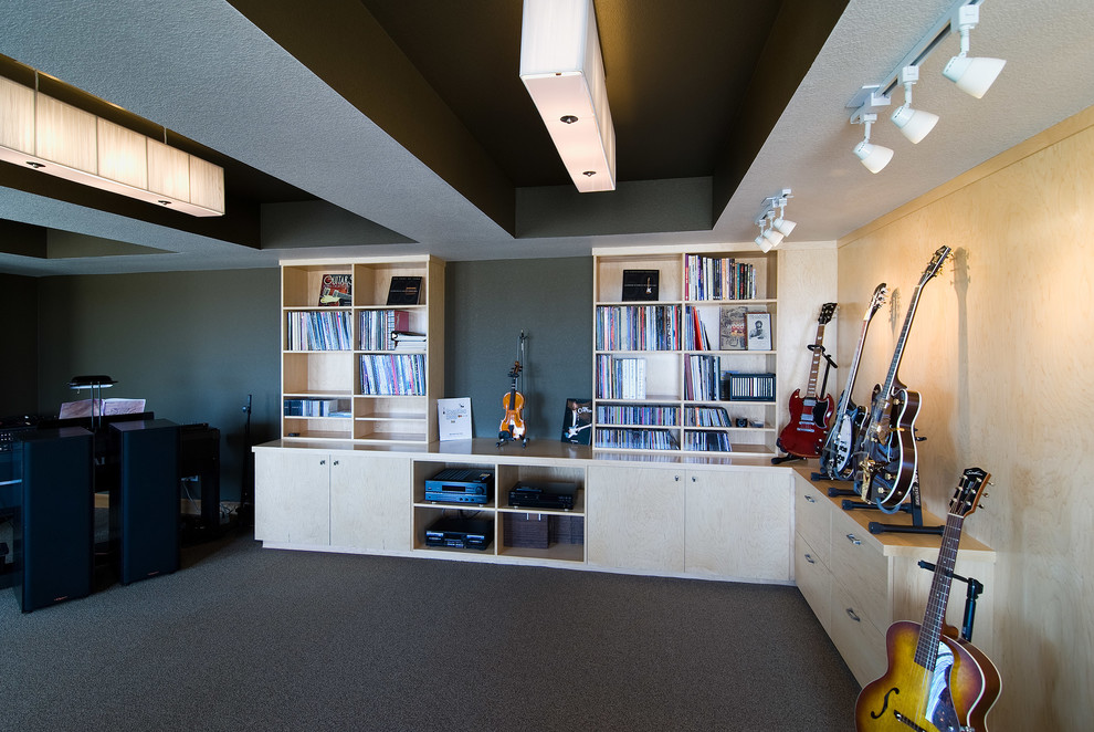 Large transitional look-out carpeted and gray floor basement photo in Denver with gray walls and no fireplace