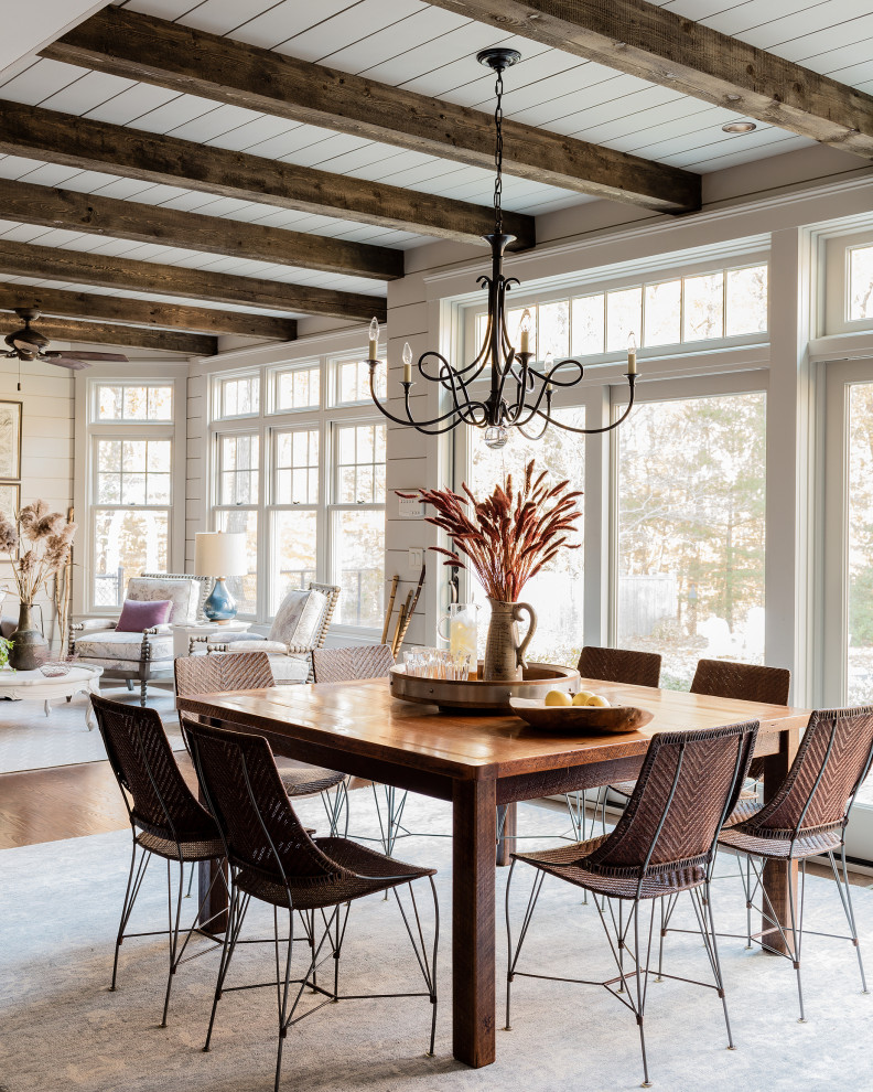 This is an example of a large traditional kitchen/dining combo in Boston with grey walls, dark hardwood floors, brown floor, exposed beam and planked wall panelling.