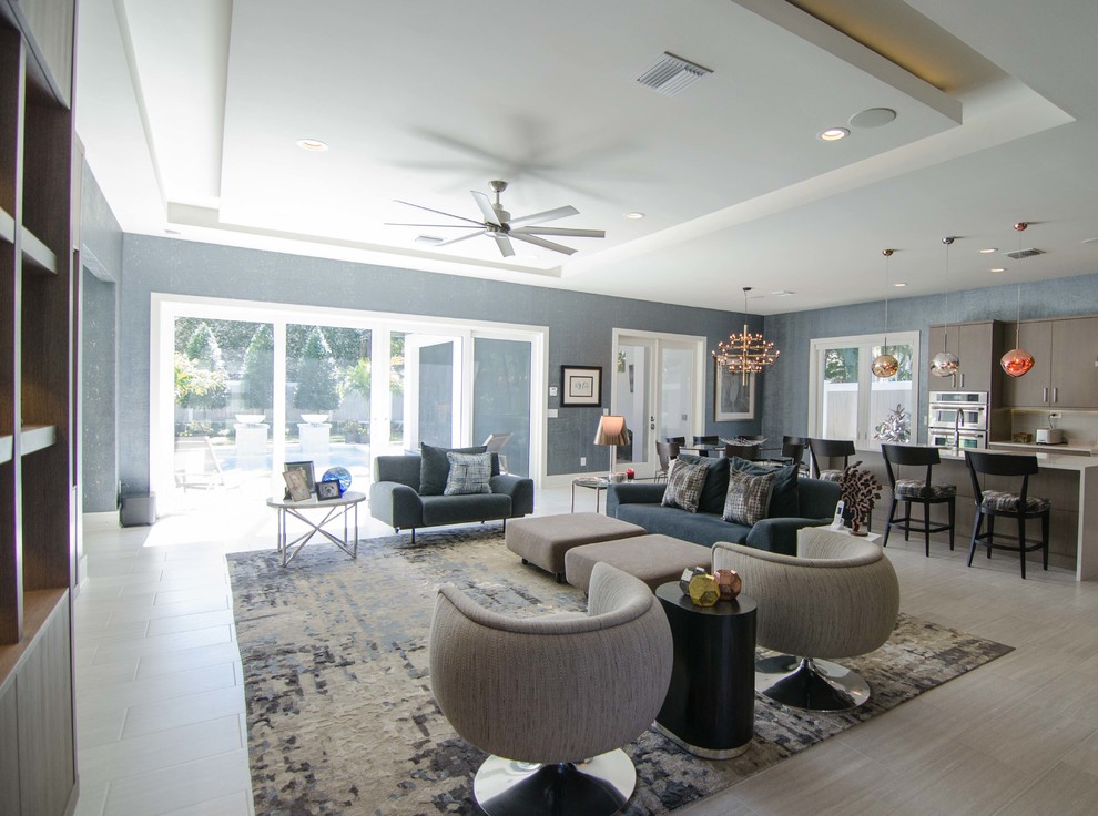 Large contemporary open concept family room in Orlando with ceramic floors.