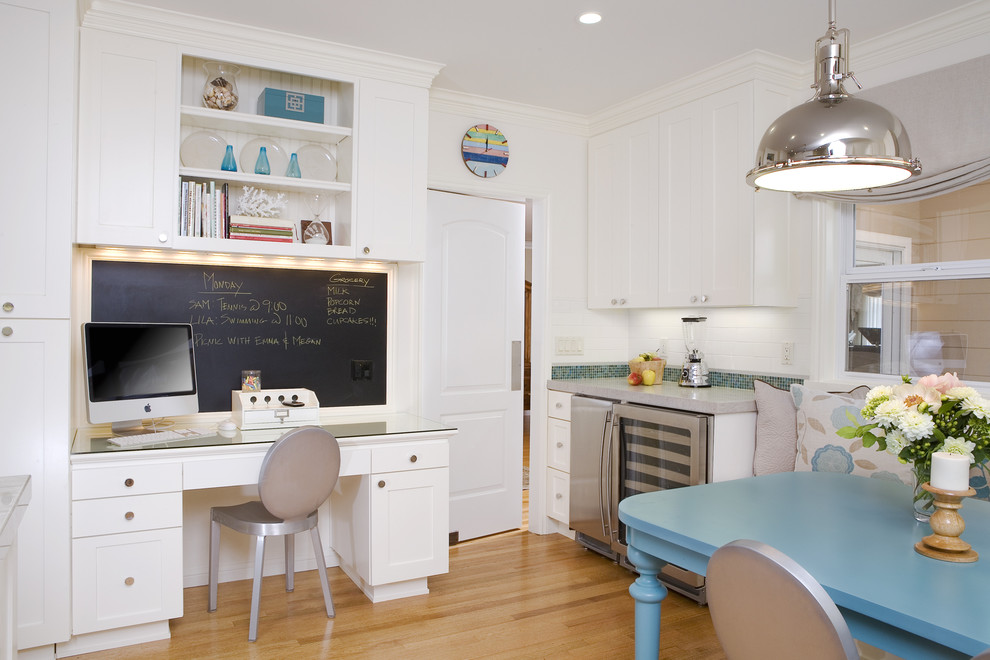 Photo of a traditional kitchen in San Francisco with shaker cabinets, white cabinets, white splashback, subway tile splashback and stainless steel appliances.