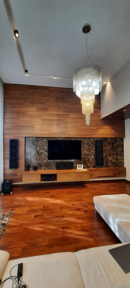 Large contemporary formal loft-style living room in Moscow with white walls, medium hardwood floors, a hanging fireplace, black floor and wood.