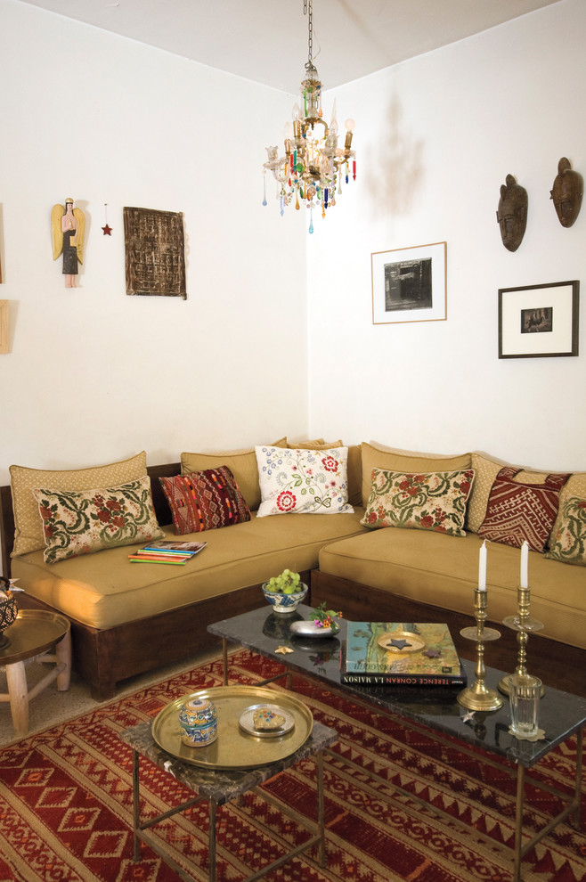 This is an example of a mediterranean living room in New York with white walls.