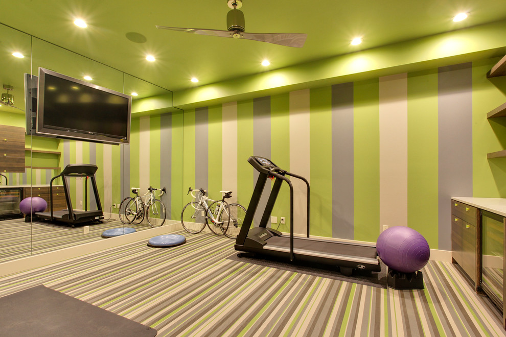 Inspiration for a contemporary home gym in Calgary with green walls.