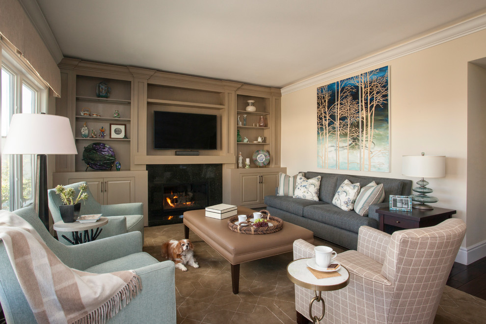 Mid-sized traditional open concept family room in Los Angeles with beige walls, dark hardwood floors, a standard fireplace, a stone fireplace surround and a built-in media wall.