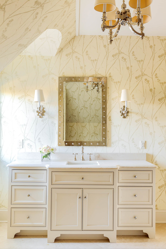 Inspiration for an expansive traditional master wet room bathroom in Nashville with recessed-panel cabinets, white cabinets, a freestanding tub, a two-piece toilet, terra-cotta tile, beige walls, travertine floors, an undermount sink, marble benchtops, white floor, an open shower and white benchtops.