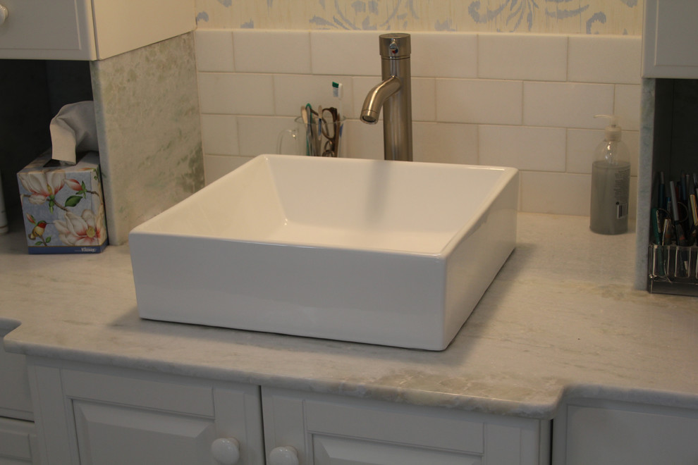 Design ideas for a small transitional master bathroom in Boston with a vessel sink, raised-panel cabinets, white cabinets, white tile, ceramic tile, marble benchtops, an alcove shower and a two-piece toilet.