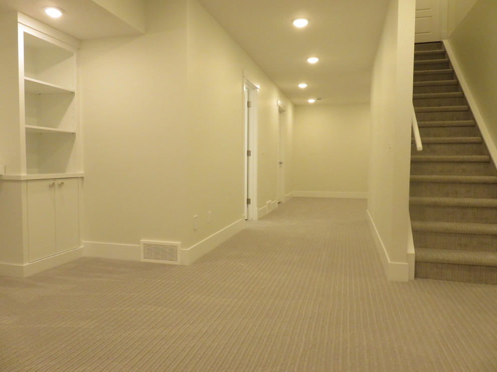 Basement - mid-sized transitional look-out carpeted and gray floor basement idea in Calgary with white walls