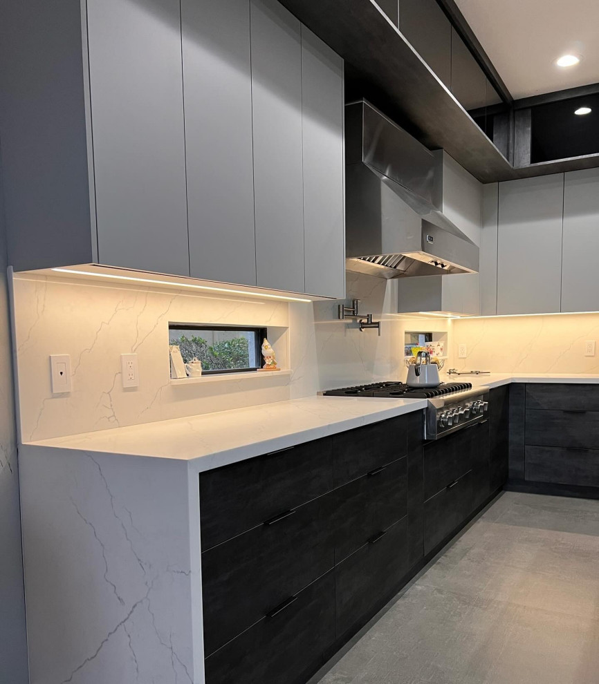 Immagine di una cucina abitabile design di medie dimensioni
