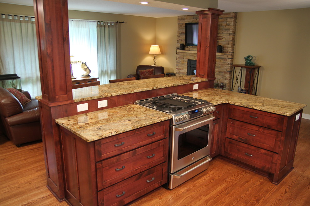 Inspiration for a rustic kitchen remodel in Minneapolis with a farmhouse sink, flat-panel cabinets and medium tone wood cabinets
